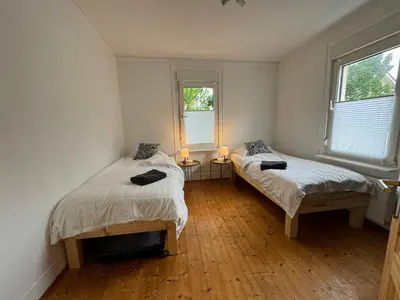 Ein Bett oder Betten in einem Zimmer der Unterkunft 90qm 4-Zimmer-Wohnung - Apartment Friedrichstraße