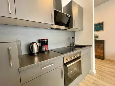 Küche/Küchenzeile in der Unterkunft Goldstadt Comfort Suite - City Apartment Schlössle