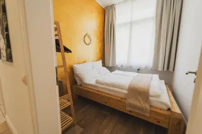 Ein Bett oder Betten in einem Zimmer der Unterkunft Moderne Altbauwohnung