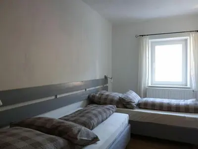 Ein Bett oder Betten in einem Zimmer der Unterkunft Holiday apartment Bambi in the house at the linden