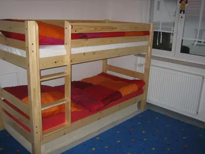 Ein Etagenbett oder Etagenbetten in einem Zimmer der Unterkunft Ferienwohnung Falkenweg