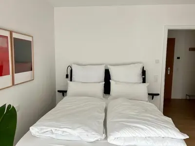 Ein Bett oder Betten in einem Zimmer der Unterkunft Schickes 2-Zi-Apartment am Neckarufer im BUGA-Park