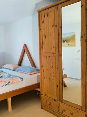 Ein Bett oder Betten in einem Zimmer der Unterkunft Ferienwohnung zwischen Weinheim und Hemsbach