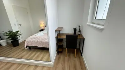 Ein Bett oder Betten in einem Zimmer der Unterkunft Das Loft - Sauna - 4 Schlafzimmer - 2 Bäder - Stadtmitte - 2 Parkplätze