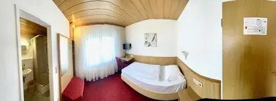 Ein Bett oder Betten in einem Zimmer der Unterkunft Hotel Dreieich