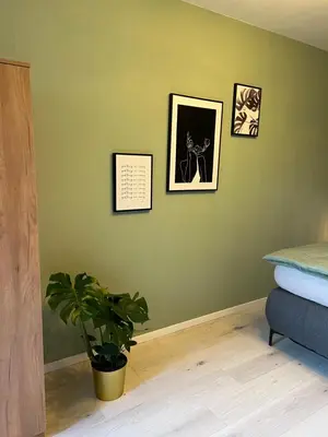 Ein Bett oder Betten in einem Zimmer der Unterkunft Moderne, helle Terrassenwohnung im Kurort