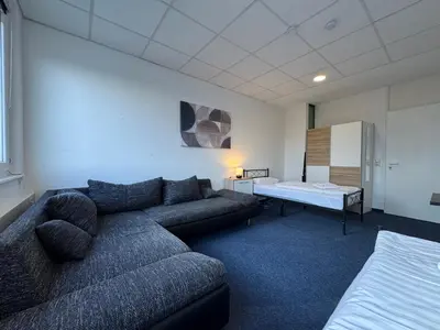 Ein Bett oder Betten in einem Zimmer der Unterkunft Thuja Apartments Karlsruhe-Neureut by KurzZeit