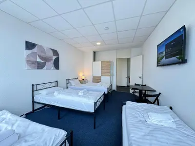 Ein Bett oder Betten in einem Zimmer der Unterkunft Thuja Apartments Karlsruhe-Neureut by KurzZeit