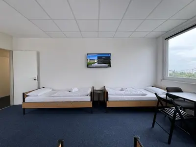 Ein Bett oder Betten in einem Zimmer der Unterkunft Thuja Apartments Karlsruhe-Neureut by KurzZeit