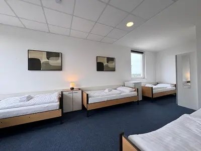 Ein Bett oder Betten in einem Zimmer der Unterkunft Thuja Apartments Karlsruhe-Neureut by KurzZeit