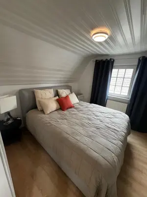 Ein Bett oder Betten in einem Zimmer der Unterkunft Lilli's Gästehaus