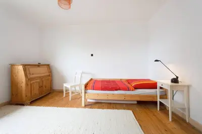 Ein Bett oder Betten in einem Zimmer der Unterkunft Sekretärzimmer 2