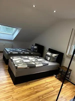 Ein Bett oder Betten in einem Zimmer der Unterkunft KRAICHGAU # 3-ZKB mit Balkon und Klimaanlage, Monteurzimmer