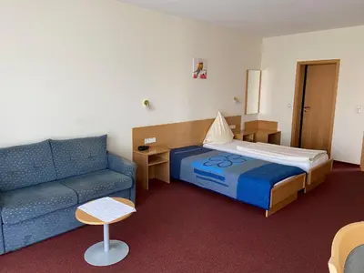 Ein Bett oder Betten in einem Zimmer der Unterkunft Pension Zum Bahnhof