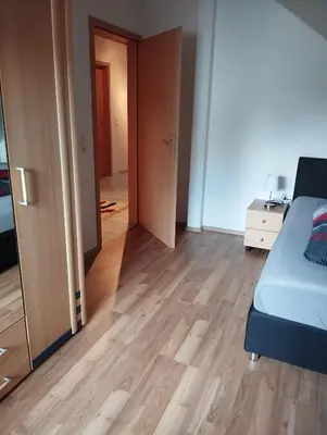 Ein Bett oder Betten in einem Zimmer der Unterkunft Ferienwohnung Zur Schönen Aussicht