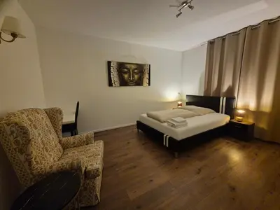 Ein Bett oder Betten in einem Zimmer der Unterkunft Gemütliche Ferienwohnung direkt an der Uniklinik Mainz
