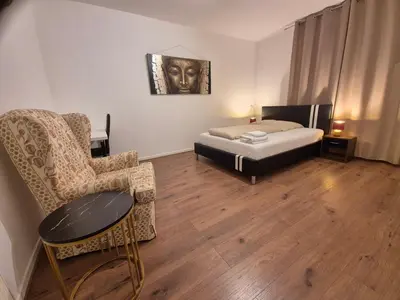 Ein Bett oder Betten in einem Zimmer der Unterkunft Gemütliche Ferienwohnung direkt an der Uniklinik Mainz