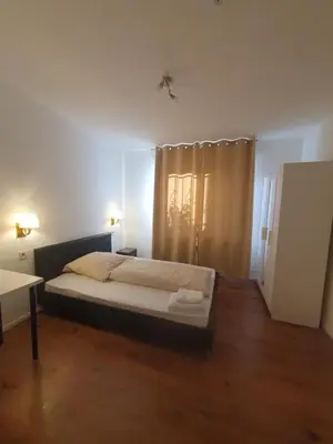 Ein Bett oder Betten in einem Zimmer der Unterkunft Gemütliche Ferienwohnung direkt an der Uniklinik Mainz