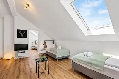 Ein Bett oder Betten in einem Zimmer der Unterkunft Ferienwohnung Bad Friedrichshall 5BR 10 beds, TV & kitchen
