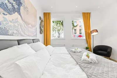 Ein Bett oder Betten in einem Zimmer der Unterkunft Lemon3 - privater Garten mit Grill, Mini-Gym, zentral in Karlsruhe