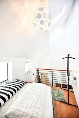Ein Bett oder Betten in einem Zimmer der Unterkunft Ferienloft 'Weinstube Fridrich'