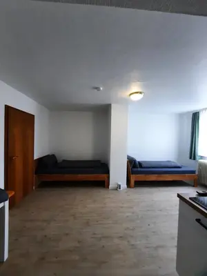 Ein Bett oder Betten in einem Zimmer der Unterkunft Monteurwohnung - Handwerkerwohnung Jesse Bad König