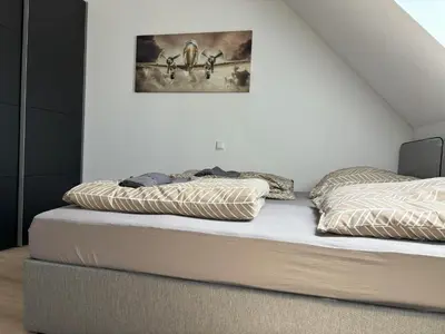 Ein Bett oder Betten in einem Zimmer der Unterkunft Apartments Leimen