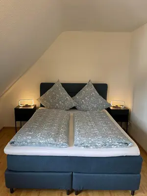 Ein Bett oder Betten in einem Zimmer der Unterkunft Ferienwohnung am Kelterplatz