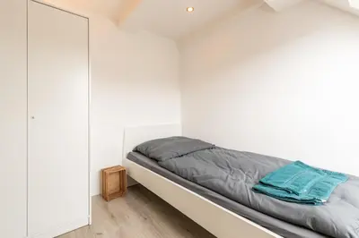 Ein Bett oder Betten in einem Zimmer der Unterkunft Monteurapartment I 12 Betten I Küche I Waschmaschine I Balkon I Nieder-Klingen