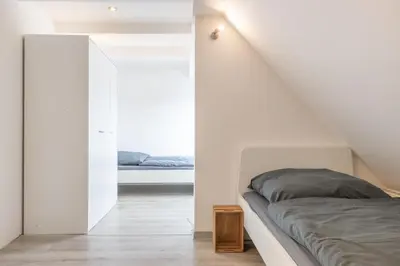 Ein Bett oder Betten in einem Zimmer der Unterkunft Monteurapartment I 12 Betten I Küche I Waschmaschine I Balkon I Nieder-Klingen