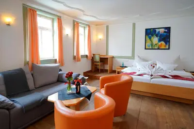 Ein Bett oder Betten in einem Zimmer der Unterkunft Hotel Adler am Schloss
