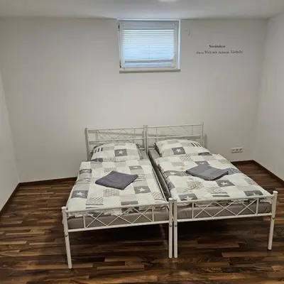 Ein Bett oder Betten in einem Zimmer der Unterkunft Smarte Unterkünfte nach Ihren Bedürfnissen