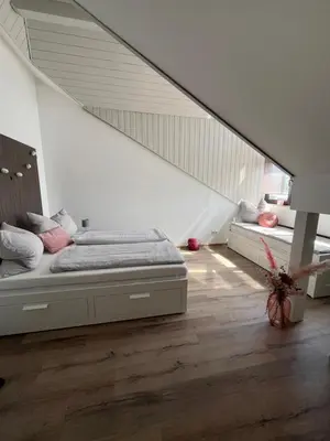 Ein Bett oder Betten in einem Zimmer der Unterkunft Moderne Wohnung mit Dachterrasse