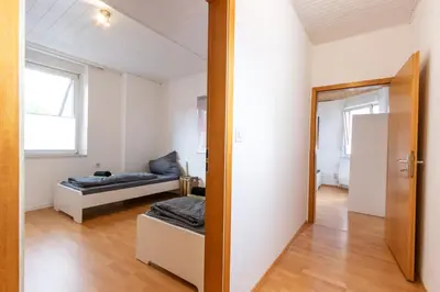 Ein Bett oder Betten in einem Zimmer der Unterkunft Wohnung für 8 Personen in ehemaligem Weingut mit 4 Schlafzimmern