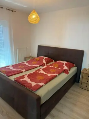 Ein Bett oder Betten in einem Zimmer der Unterkunft Pfalzgrün - Wohnen mit Stil
