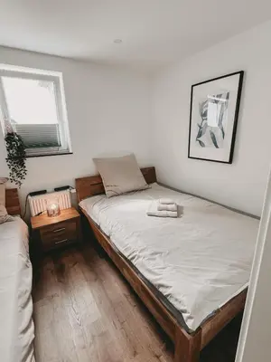 Ein Bett oder Betten in einem Zimmer der Unterkunft Melem Apartments