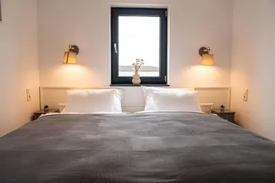 Ein Bett oder Betten in einem Zimmer der Unterkunft DOM Inn