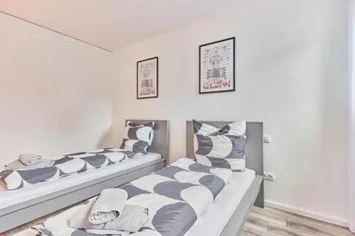 Ein Bett oder Betten in einem Zimmer der Unterkunft Zentrale Lage Netflix Queensize Bett