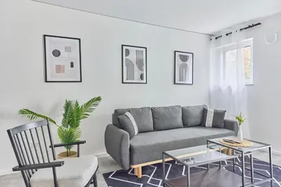 Ein Sitzbereich in der Unterkunft Zentrale Lage Netflix Queensize Bett