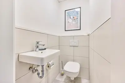 Ein Badezimmer in der Unterkunft Zentrale Lage Netflix Queensize Bett