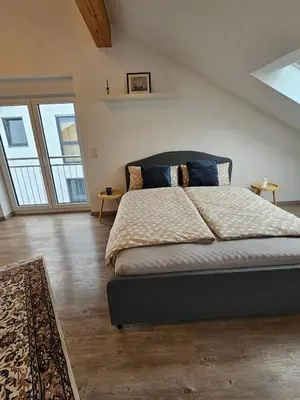 Ein Bett oder Betten in einem Zimmer der Unterkunft Moderne Doppelhaushälfte in Oppenheim