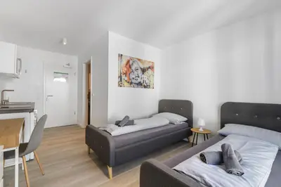 Ein Bett oder Betten in einem Zimmer der Unterkunft LIVINGBOXX Karlsruhe - Messe I neuwertige Apartments mit Küche