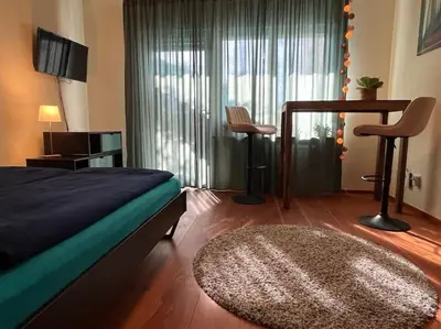Ein Bett oder Betten in einem Zimmer der Unterkunft City Chillout Heidelberg Appartement with Sauna & Pool