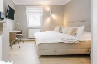 Ein Bett oder Betten in einem Zimmer der Unterkunft YOUPARTMENTS - zentrale Micro Apartments