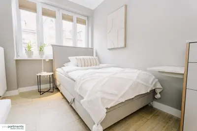 Ein Bett oder Betten in einem Zimmer der Unterkunft YOUPARTMENTS - zentrale Micro Apartments