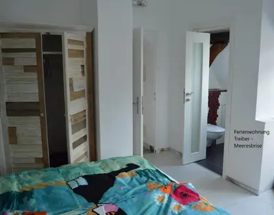 Ein Bett oder Betten in einem Zimmer der Unterkunft Ferienwohnungen Treiber in Eggenstein-Leopoldshafen - Nähe KIT Campus Nord und Karlsruhe