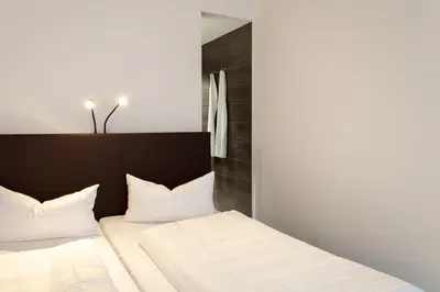 Ein Bett oder Betten in einem Zimmer der Unterkunft Tobbaccon Hotel