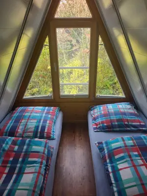 Ein Bett oder Betten in einem Zimmer der Unterkunft Nurdachhaus Ferienpark Schellbronn