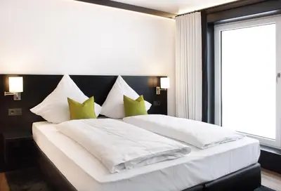 Ein Bett oder Betten in einem Zimmer der Unterkunft LPH Hotel by WMM Hotels