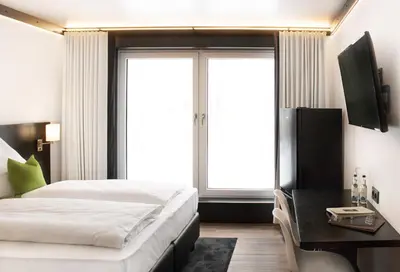 Ein Bett oder Betten in einem Zimmer der Unterkunft LPH Hotel by WMM Hotels